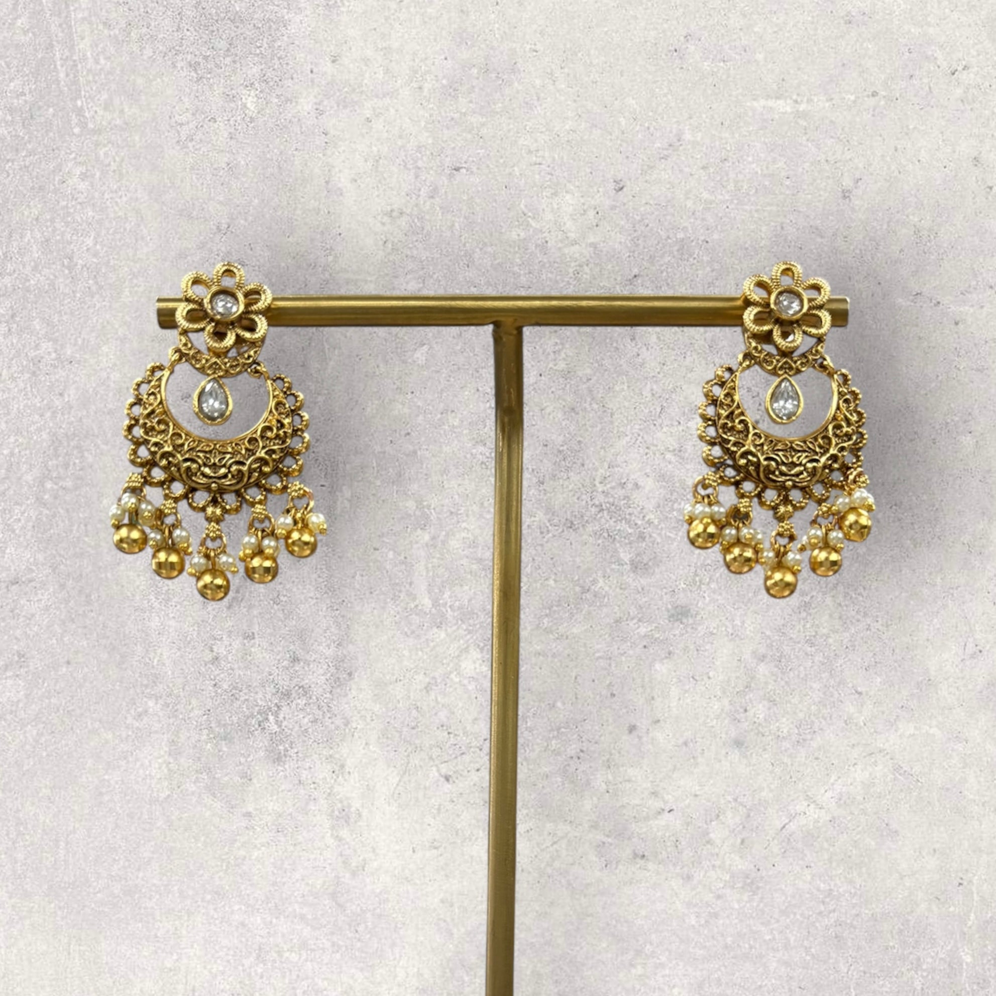 Hanging gold temple style earrings